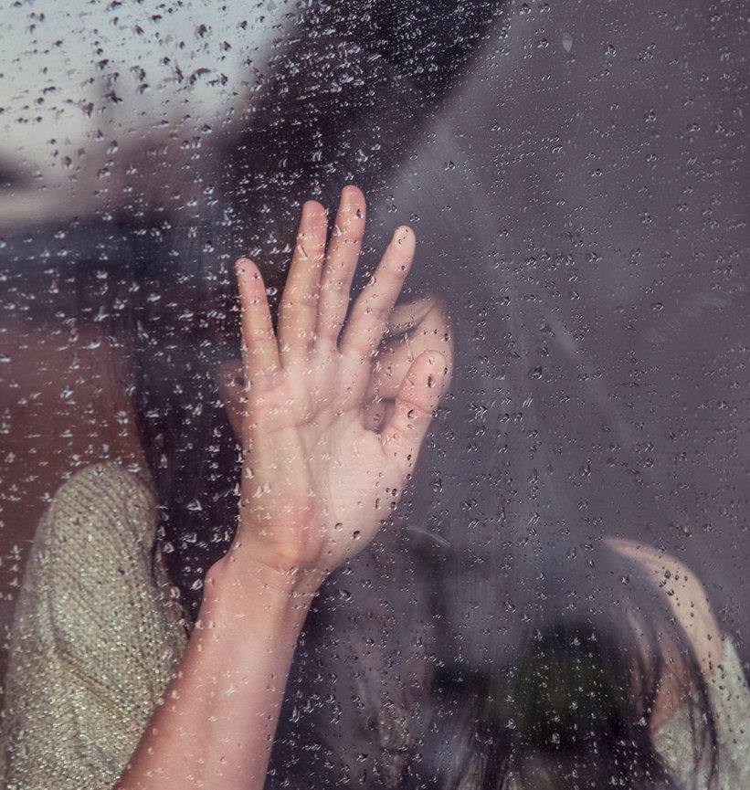 Woman behind glass