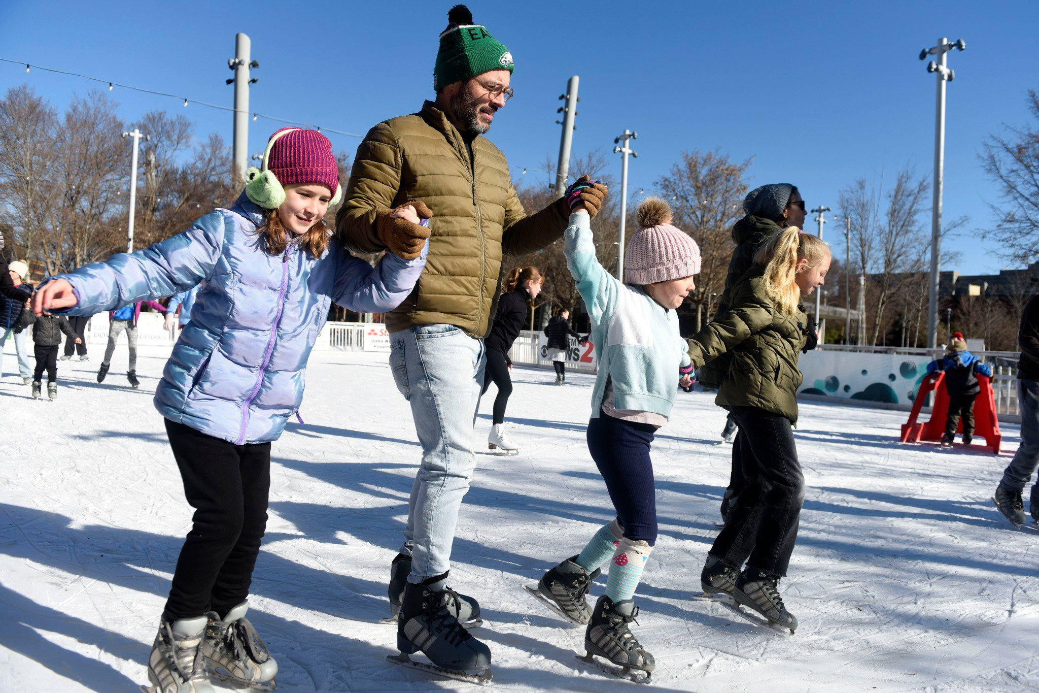 Photo of a Friendly Park family ice skating in January 2024